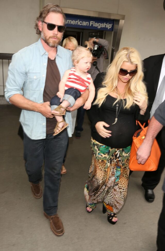 Pregnant Jessica Simpson makes her way through LAX with fiance Eric Johnson and their baby daughter Maxwell in Los Angeles