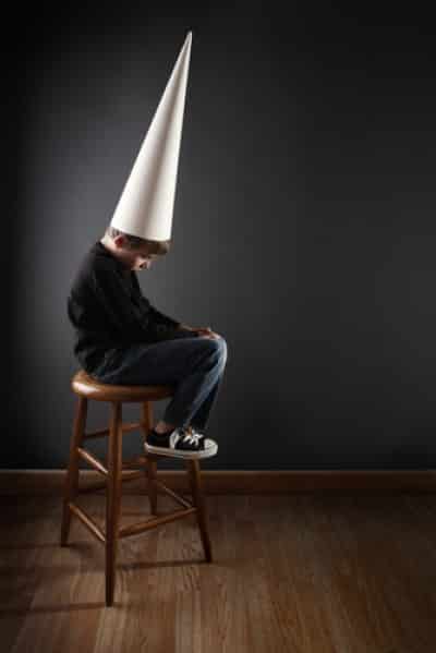 child with dunce cap