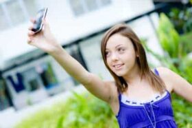 girl-taking-picture-with-phone