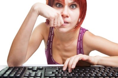 woman looking into computer