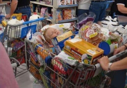 kid buried in grocery cart