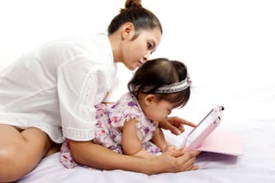 mom with baby and tablet