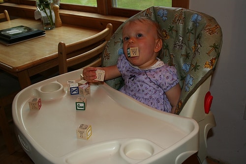 toddler eating blocks