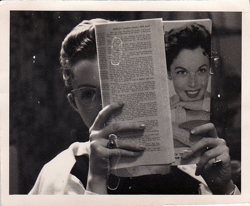 1950s woman reading magazine