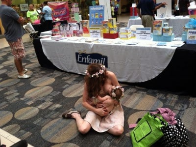 Elicia-Binman-breastfeeding-in front of formula booth