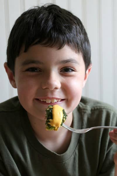 boy with cheese brocoli