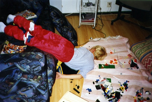 kid asleep on floor with legos
