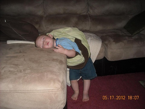 toddler asleep on couch
