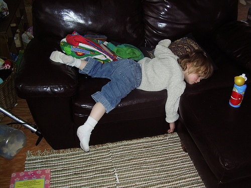 toddler passed out on sofa