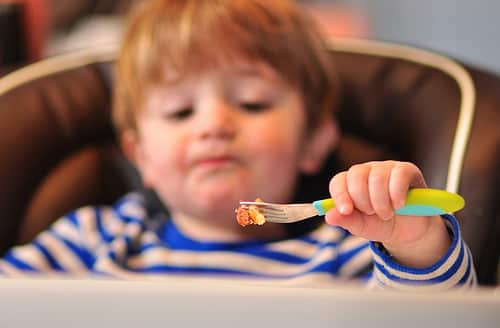 toddler with fork