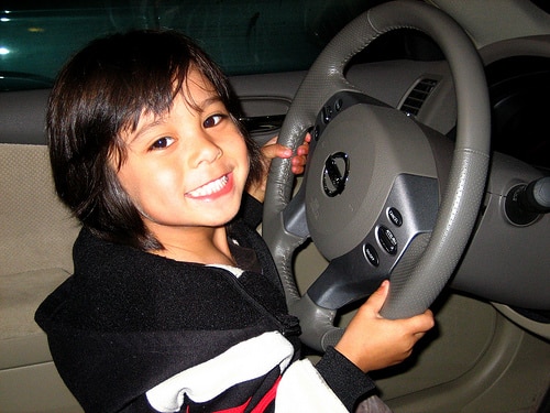 toddler at steering wheel