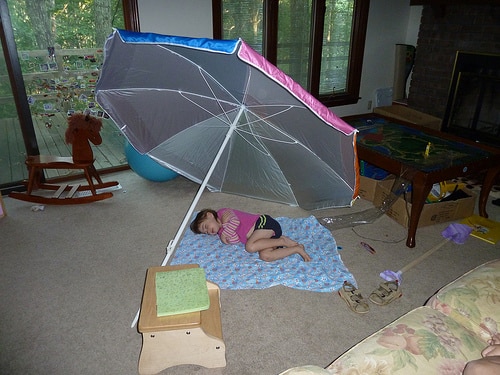 toddler nap under umbrella