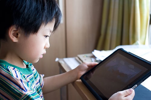 a kid with iPad