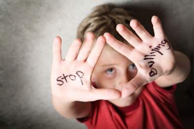Boy with stop bullying on hands