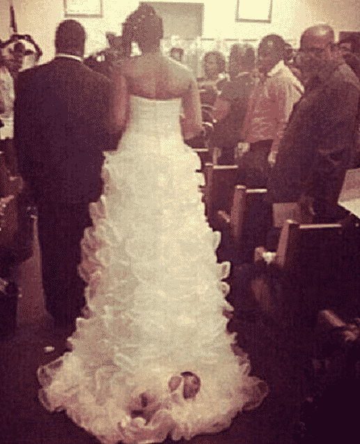 Bride Attaches Newborn To Wedding Dress 