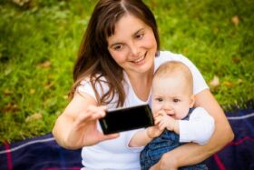 mom taking selfie with baby