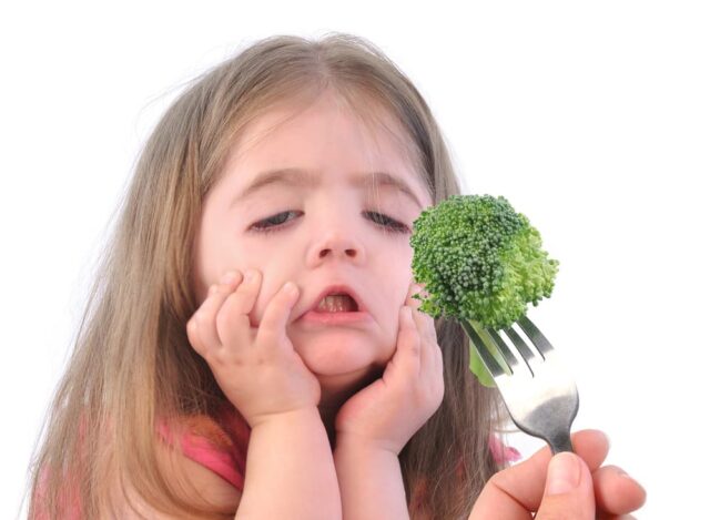little girl hates broccoli