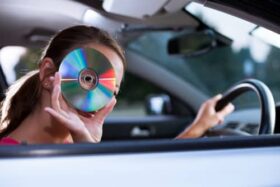 mom in car with CD