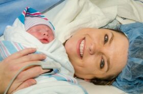 mother-holding-baby-after-c-section