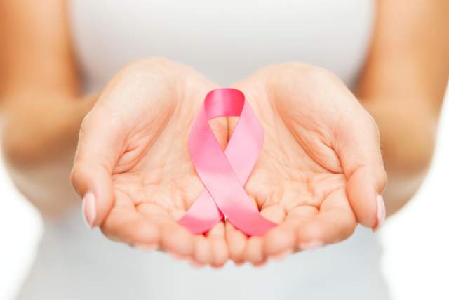 breast cancer ribbon in hands