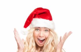 excited woman in santa hat