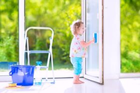 little-girl-cleaning-windows