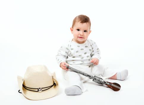 baby-playing-with-gun
