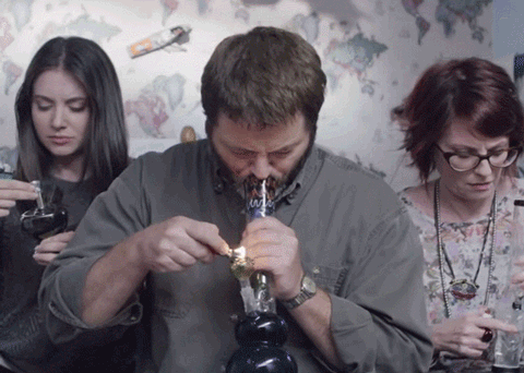people smoking from a pipe