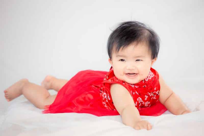 baby girl smiling red dress