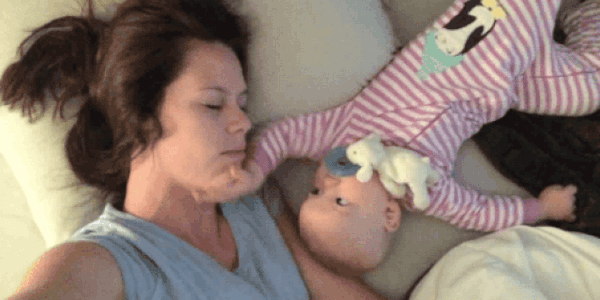 baby punching mom in the face while co-sleeping 